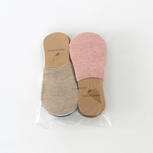 Detail view of cotton invisible low-cut socks in multiple colors with cardboard inserts