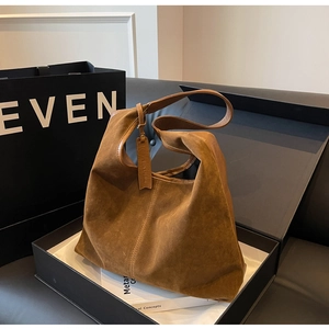 Brown velvet tote bag presented in a black gift box with a minimalist retro design