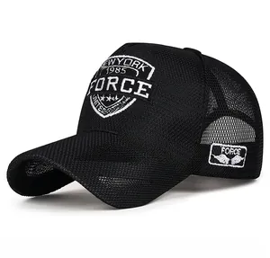 Detail of black mesh baseball cap with embroidered shield patch and side logo