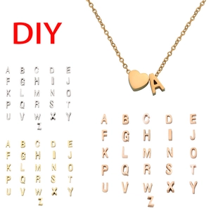 Detail view of heart pendant with DIY gold, silver and rose gold alphabet beads set