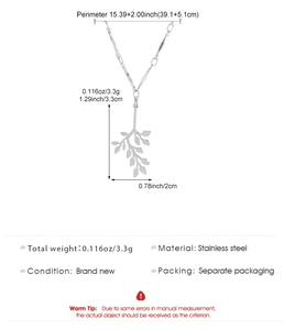 Macro detail of silver stainless steel leaf pendant showing precise dimensions and size