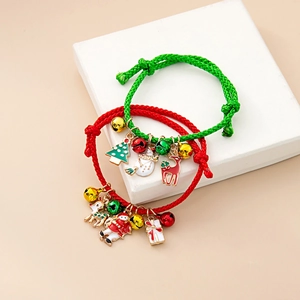 Detail of woven Christmas bracelets with Santa Claus charms and colorful jingling bells