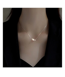 Close-up of S925 sterling silver necklace featuring baroque pearl and metal bead detail