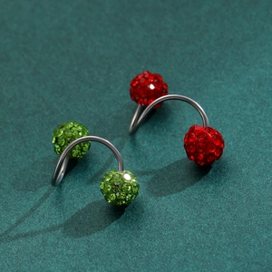 Macro shot of red and green disco ball screw earrings with sparkling rhinestones