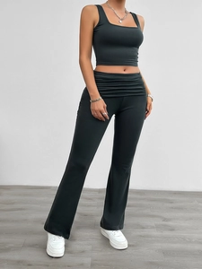 Detail view of charcoal grey knit two-piece set with square neck top and flared pants