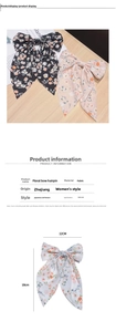 Detailed view of floral fabric bow hair clip with 12x18cm dimensions for women