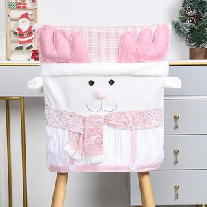 Detail of pink Christmas reindeer chair cover with plush fabric and sequined scarf accent