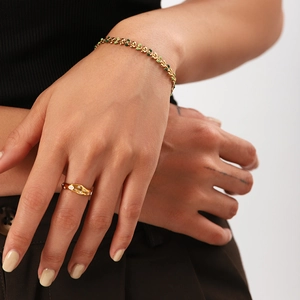 18K gold stainless steel leaf bracelet with green enamel and jewels on model