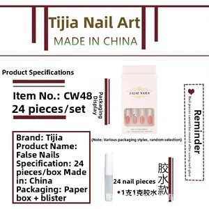 Detail of pink gradient press-on nails set with rhinestones and glue 24pcs box
