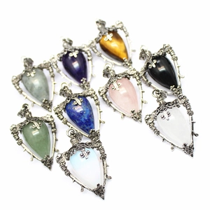 Gothic style crystal pendants with heart and shield shapes in various gemstone colors