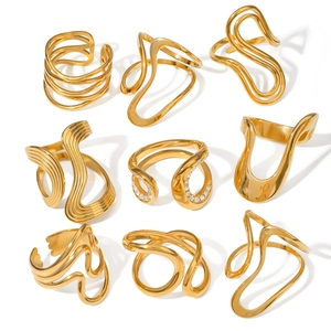 Set of 9 chunky gold stainless steel rings with geometric hollow and wavy designs