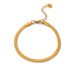 Detailed macro of gold herringbone snake chain with lobster clasp and adjustable steel tag