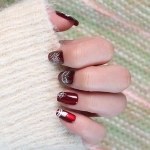 Deep wine red cat-eye press-on nails with festive lion dance and firework hand-painted art