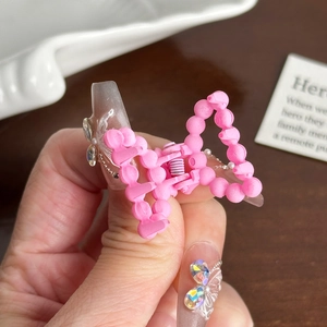 Matte pink beaded butterfly hair claw clip for women's half-up hairstyles