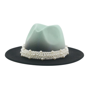 Detailed view of luxury white pearl beads and mint green gradient wool felt jazz hat