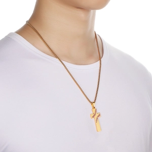 Macro view of gold stainless steel cross pendant with baseball stitching on box chain