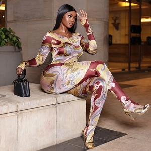 Slim fit long sleeve bodysuit with burgundy and gold ripple print on silky fabric