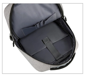 Detailed view of internal laptop compartment with strap and organizing pockets