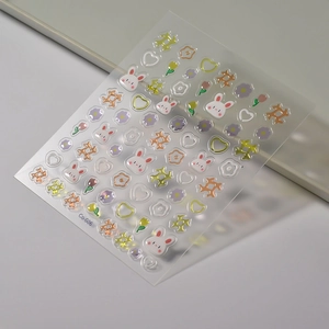 Detail of 3D jelly nail stickers with cartoon rabbits and colorful floral star patterns