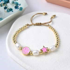 Close-up of a colorful star and smiley bead bracelet with freshwater pearls and cord
