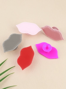 Silicone lip scrubbers in five colors featuring soft bristles and suction cup handles