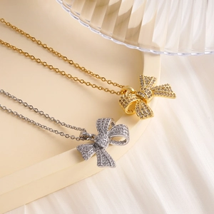 Elegant bow pendant necklace with zircon inlays on fine chain, gold and silver options
