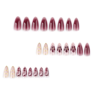 Almond shaped press-on nails with burgundy gradient, gold accents, and floral patterns