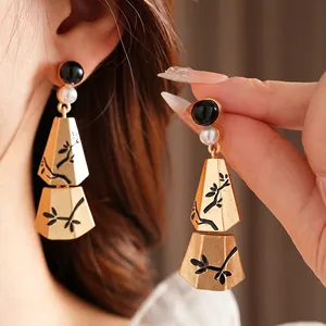 Long branch pearl tassel earrings with black beads and vintage matte gold trapezoid plates