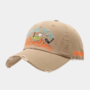 Detail of golf embroidery and distressed brim on khaki washed cotton baseball cap