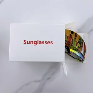 Close-up of rimless sports sunglasses with graffiti frame and white branded packaging box