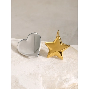 Polished silver heart and gold star charms on stone base, minimalist metal accessories