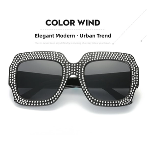Macro detail of square black frame sunglasses with three rows of sparkling silver rhinestones