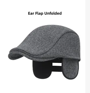 Detail of unfolded ear flaps on grey wool blend winter flat cap for men