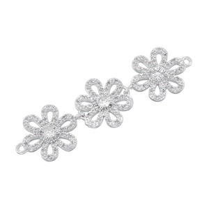 Detail of silver floral jewelry connector with three cubic zirconia inlaid flowers