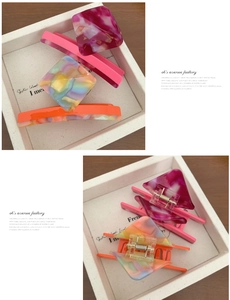 Detail showing colorful acetate square hair claw clips with gold leaf and shell patterns