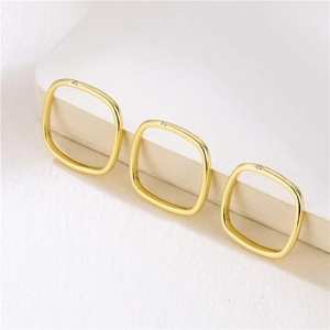 Minimalist gold square rings set with zircon stones in a stylish layered arrangement