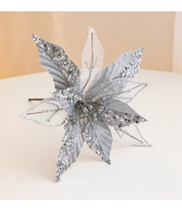 Close-up of artificial silver Christmas flower with sparkling sequins and glitter texture