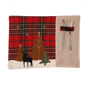 Christmas plaid linen placemat with embroidered reindeer and trees for holiday dining