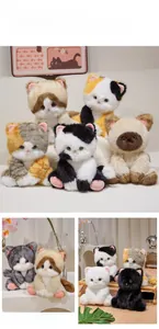 Detailed plush kittens in various patterns like calico and siamese on home decor setup