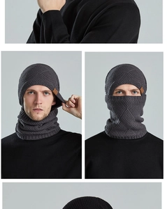 Detail of dark grey men's knitted winter balaclava with warm fleece lining and leather tag