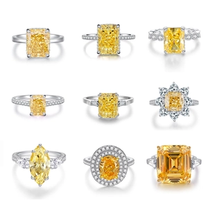 Collection of nine yellow radiant and marquise cut zircon rings in silver settings
