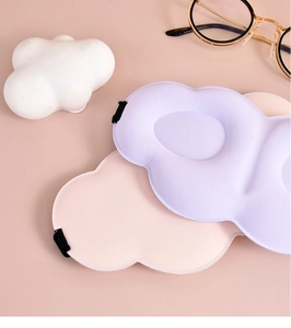 Detail view of 3D cloud-shaped sleep mask with breathable memory foam in macaron colors