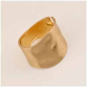 Detailed macro view of wide gold-finished alloy bracelet featuring a brushed matte texture