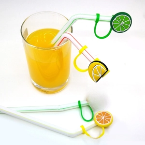 Close-up of fruit-shaped silicone straw covers including lime, lemon, and watermelon slice designs