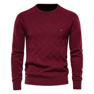 Close-up of wine red men's cotton knit sweater showing detailed diamond weave texture