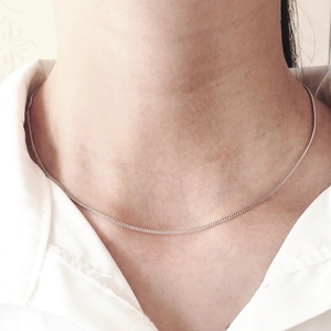 Minimalist 925 sterling silver chain necklace for women worn with white shirt