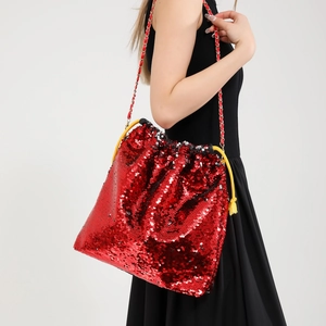 Sparkly red sequin bucket bag with golden chain strap and yellow drawstring closure