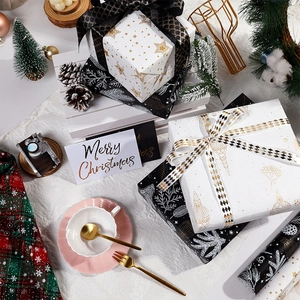 Luxury gold-foamed Christmas wrapping paper set with elegant ribbons and festive patterns