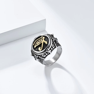 Detail view of vintage stainless steel Egyptian Pharaoh Eye of Horus ring with gold accents