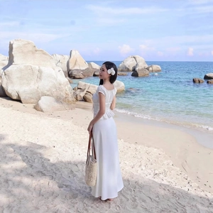 Elegant white two-piece square neck puff sleeve crop top and flowy maxi skirt for vacation